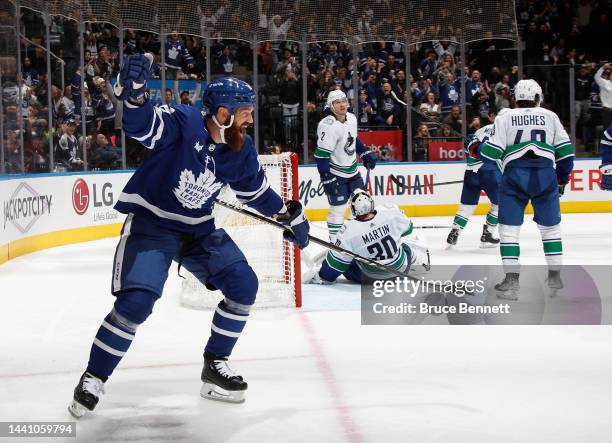 Jordie Benn of the Toronto Maple Leafs scores his first goal as a Leaf against the Vancouver Canucks during the second period at the Scotiabank Arena...