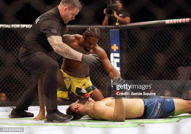 The referee stops the fight after Ryan Spann knocks down Dominick Reyes in the 1st round of their fight during UFC 281 at Madison Square Garden on...