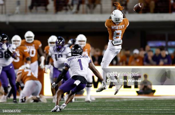 Xavier Worthy of the Texas Longhorns cannot catch a pass defended by Tre'Vius Hodges-Tomlinson of the TCU Horned Frogs in the first quarter of the...