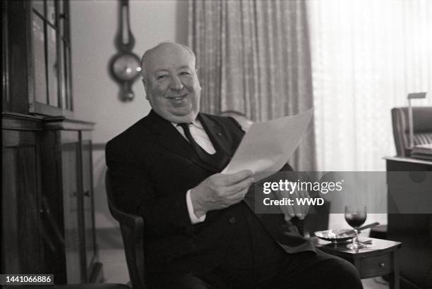 Director Alfred Hitchcock being interviewed in his Los Angeles office