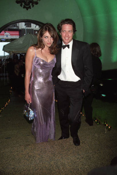 Outtake; Hugh Grant and Elizabeth Hurley attend the CFDA American Fashion Awards ceremony at the 69th Regiment Armory on June 3, 1999 in New...