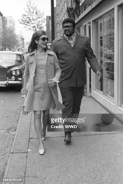 Published; Cropped for publication; Also ran in W 6/16/1972 p4; Jacqueline Kennedy Onassis walking alongside Roosevelt "Rosie" Grier after a late...