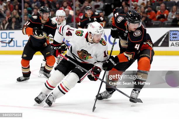Cam Fowler of the Anaheim Ducks defends against Boris Katchouk of the Chicago Blackhawks during the first period of a game at Honda Center on...