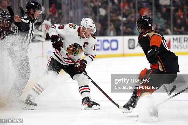 Jonathan Toews of the Chicago Blackhawks controls the puck as Cam Fowler of the Anaheim Ducks defends during the first period of a game at Honda...