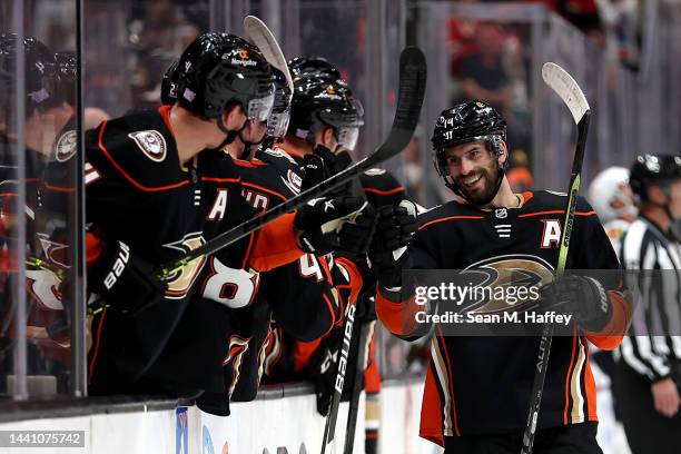 Adam Henrique of the Anaheim Ducks is congratulated at the bench after his goal during the first period of a game against the Chicago Blackhawks at...
