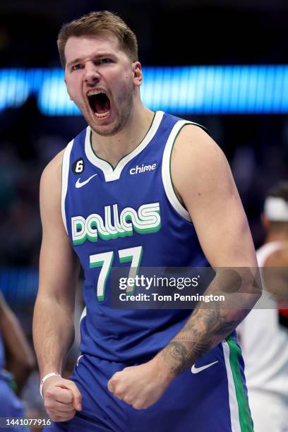 Luka Doncic of the Dallas Mavericks reacts after scoring against the Portland Trail Blazers in the fourth quarter at American Airlines Center on...