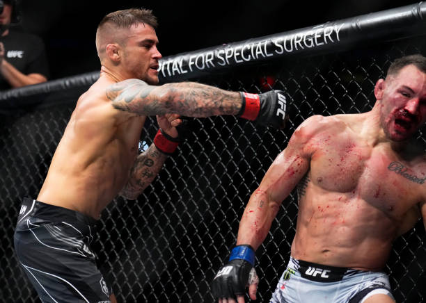 Dustin Poirier punches Michael Chandler in a lightweight bout during the UFC 281 event at Madison Square Garden on November 12, 2022 in New York City.