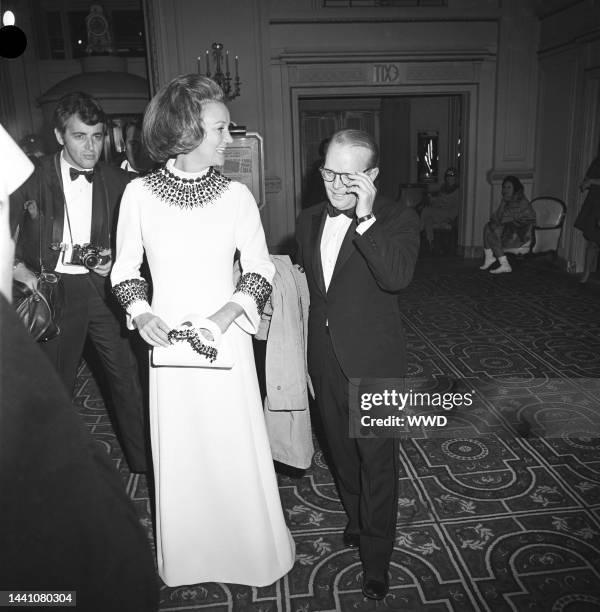 Washington Post publisher Katherine Graham and writer Truman Capote arriving at Truman Capote's Black and White Ball in the Grand Ballroom at the...