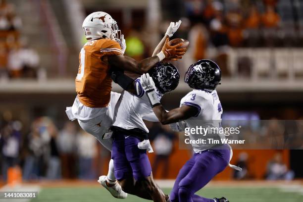 Tre'Vius Hodges-Tomlinson of the TCU Horned Frogs breaks up a pass intended for Ja'Tavion Sanders of the Texas Longhorns in the fourth quarter at...