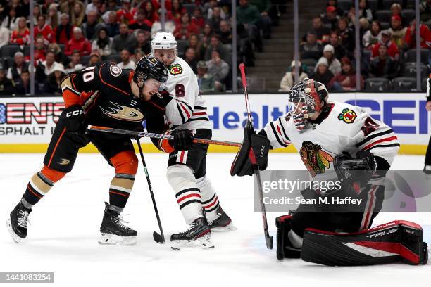 Jack Johnson and Arvid Soderblom of the Chicago Blackhawks defend against a shot by Pavol Regenda of the Anaheim Ducks during the second period of a...