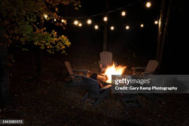 fire under the lights - backyard campfire stock pictures, royalty-free photos & images