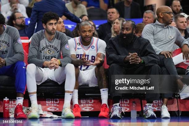 Furkan Korkmaz, P.J. Tucker, and James Harden of the Philadelphia 76ers look on from the bench against the Atlanta Hawks at the Wells Fargo Center on...