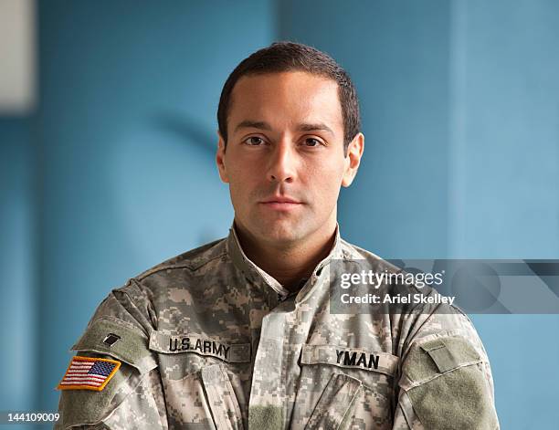 serious hispanic soldier in uniform - people in military uniform stock pictures, royalty-free photos & images