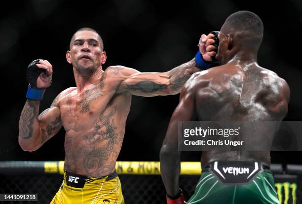 Alex Pereira of Brazil punches Israel Adesanya of Nigeria in the UFC middleweight championship bout during the UFC 281 event at Madison Square Garden...