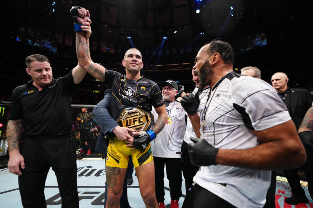 Alex Pereira of Brazil reacts after his TKO victory over Israel Adesanya of Nigeria in the UFC middleweight championship bout during the UFC 281...