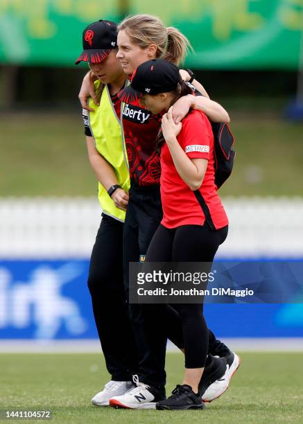 Sophie Molineux of the Renegades is assisted off the field due to an injury during the Women's Big Bash League match between the Melbourne Stars and...