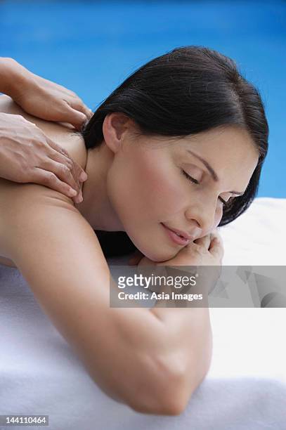woman receiving massage - singapore pool stock pictures, royalty-free photos & images