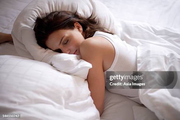 young woman sleeping - lying on front stock pictures, royalty-free photos & images