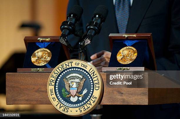 Gershwin Prizes are seen on the podium as President Barack Obama delivers remarks at a concert honoring award winners Burt Bacharach and Hal David,...