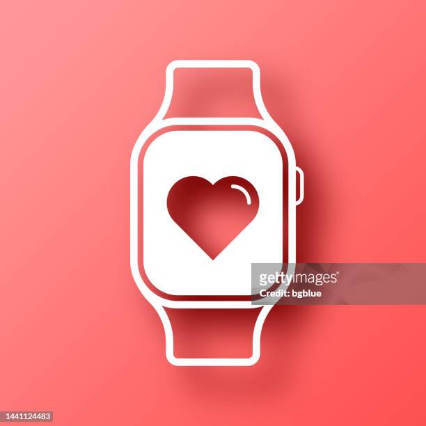 smartwatch mit herz. symbol auf rotem hintergrund mit schatten - smart watch stock-grafiken, -clipart, -cartoons und -symbole