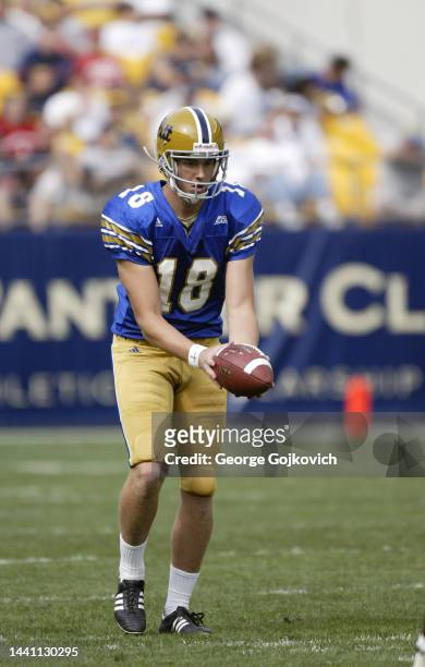 Punter Adam Graessle of the University of Pittsburgh Panthers punts against the Youngstown State Penguins during a college football game at Heinz...