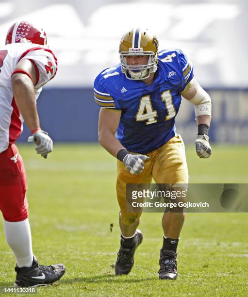 Defensive lineman Chris McKillop of the University of Pittsburgh Panthers pursues the play against the Youngstown State Penguins during a college...