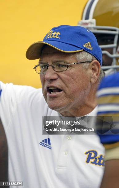 Assistant head coach Bob Junko of the University of Pittsburgh Panthers talks to players during a college football game against the Youngstown State...