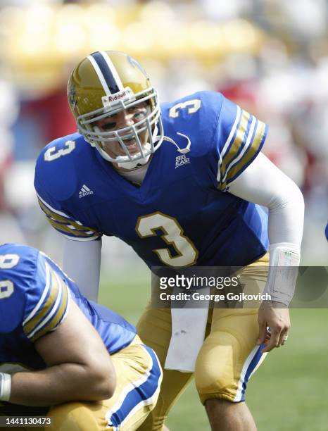 Quarterback Tyler Palko of the University of Pittsburgh Panthers stands behind center at the line of scrimmage during a college football game against...