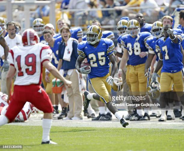 Defensive back Darrelle Revis of the University of Pittsburgh Panthers runs with the football after intercepting a pass against the Youngstown State...