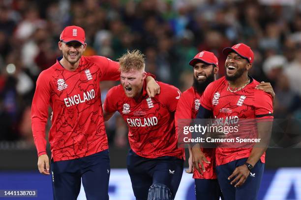 Alex Hales, Ben Stokes, Adil Rashid and Chris Jordan of England celebrate victory following the ICC Men's T20 World Cup Final match between Pakistan...