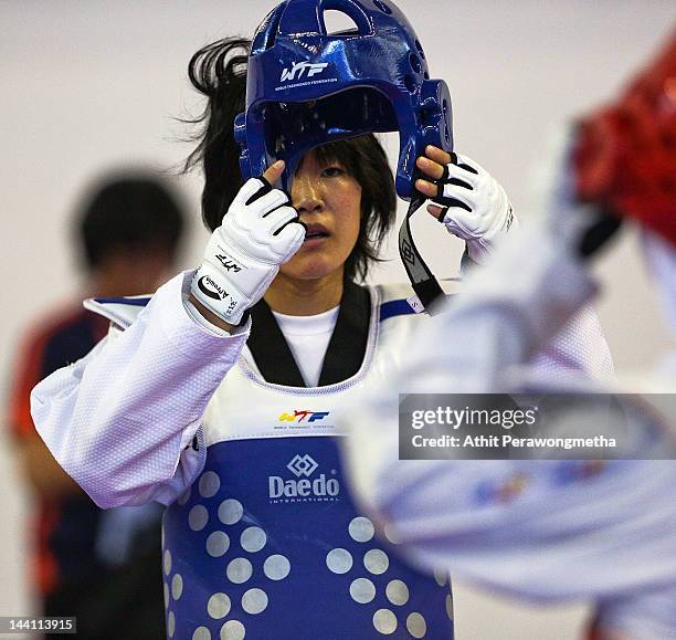 Mayu Hamada of Japan prepares during day two of the 20th Asian Taekwondo Championships at Phu Tho Stadium on May 10, 2012 in Ho Chi Minh City,...