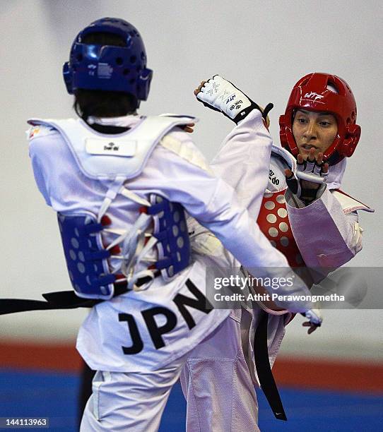 Mayu Hamada of Japan in action against Raheleh Asemani of Iran during day two of the 20th Asian Taekwondo Championships at Phu Tho Stadium on May 10,...