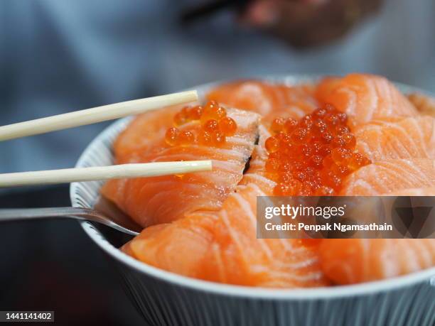 salmon sashimi salmon roe, ikura don in bowl fish seafood - ikura stock pictures, royalty-free photos & images