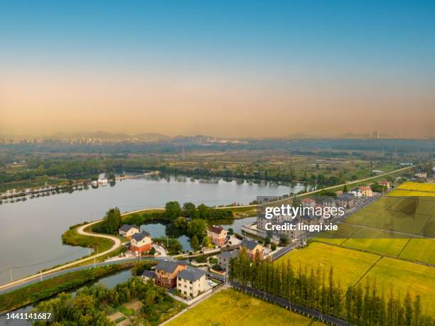 villages and rice fields in hangzhou, china from a drone perspective - china football stock pictures, royalty-free photos & images