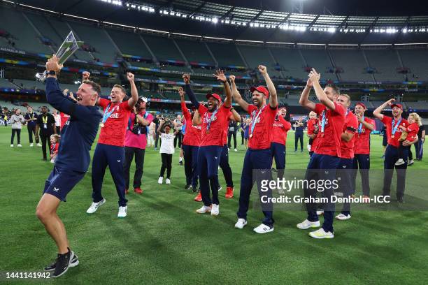 Michael Hussey and members of Team England celebrate with the ICC Men's T20 World Cup Trophy after winning the ICC Men's T20 World Cup Final match...