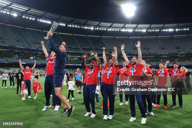 Michael Hussey and members of Team England celebrate with the ICC Men's T20 World Cup Trophy after winning the ICC Men's T20 World Cup Final match...
