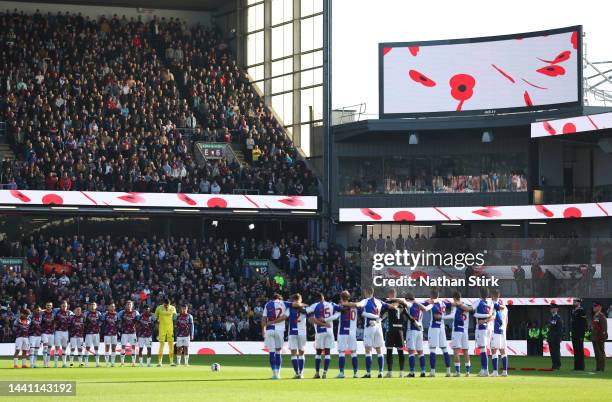 Players, staff and members of the British Armed Forces participate in a minute silence in honour of Armistice Day prior to the Sky Bet Championship...