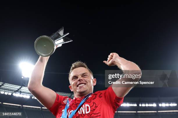 Sam Curran of England celebrates victory with the T20 World Cup trophy following the ICC Men's T20 World Cup Final match between Pakistan and England...