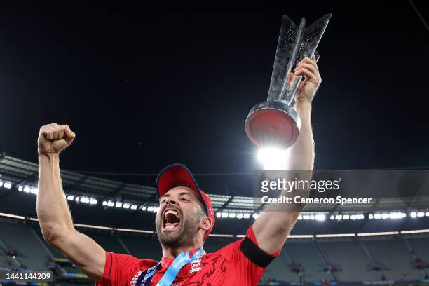 Chris Woakes of England celebrates victory with the T20 World Cup trophy following the ICC Men's T20 World Cup Final match between Pakistan and...