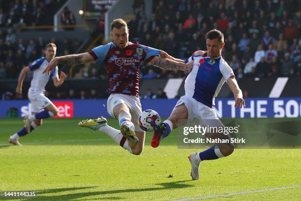 Ashley Barnes of Burnley is challenged by Dominic Hayam of Blackburn Rovers during the Sky Bet Championship between Burnley and Blackburn Rovers at...