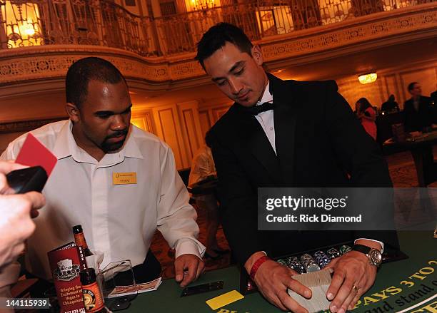 Chicago Cubs Darwin Barney deals Blackjack during the 2012 Dempster Foundation casino night at Palmer House Hotel on May 9, 2012 in Chicago, Illinois.