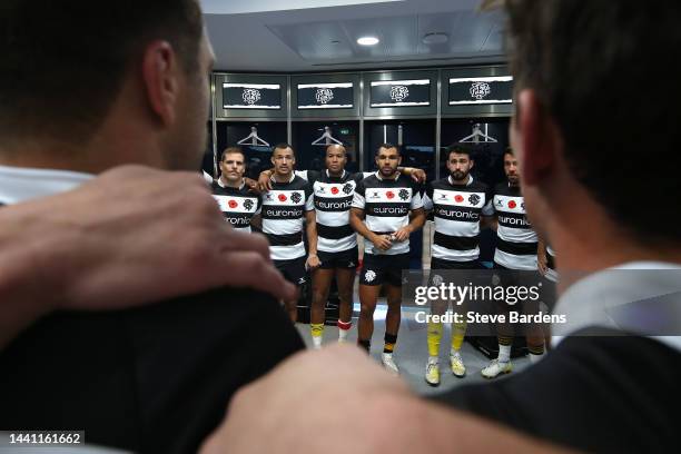 Barbarian players speak in a huddle ahead of the Killik Cup match between Barbarians and New Zealand All Blacks XV at Tottenham Hotspur Stadium on...