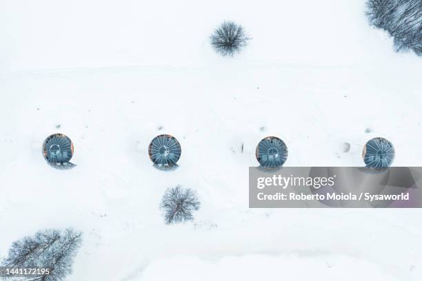 glass igloo in the snow, overhead view, sweden - igloo village stock pictures, royalty-free photos & images