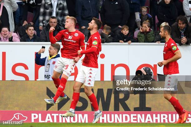 Jonathan Burkardt of 1.FSV Mainz 05 celebrates after scoring their side's first goal during the Bundesliga match between 1. FSV Mainz 05 and...