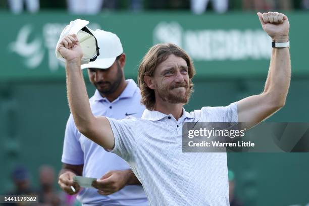 Tommy Fleetwood of England celebrates after winning the Nedbank Golf Challenge on the 18th hole during Day Four of the Nedbank Golf Challenge at Gary...