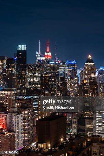 high angle night view of  midtown manhattan - new york vacation rooftop stock pictures, royalty-free photos & images