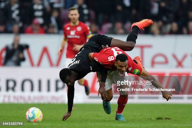Karim Onisiwo of 1.FSV Mainz 05 is challenged by Evan Ndicka of Eintracht Frankfurt during the Bundesliga match between 1. FSV Mainz 05 and Eintracht...