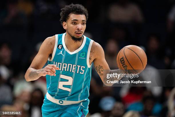 James Bouknight of the Charlotte Hornets brings the ball up court against the Washington Wizards during their game at Spectrum Center on November 07,...