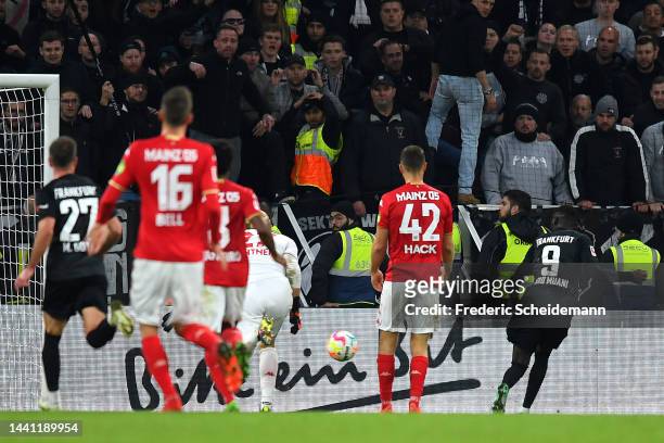 Randal Kolo Muani of Eintracht Frankfurt scores their team's first goal during the Bundesliga match between 1. FSV Mainz 05 and Eintracht Frankfurt...
