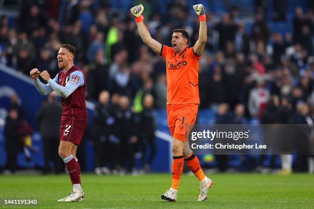 Emiliano Martinez and Matty Cash of Aston Villa celebrates following their sides victory in the Premier League match between Brighton & Hove Albion...